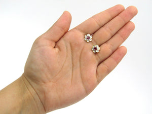 14K gold ruby and diamond flower earrings.