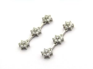 18K gold diamond drop flower earrings by Browns.