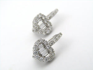 18K gold diamond heart earrings.