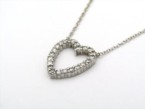 18K gold diamond heart necklace by Browns.