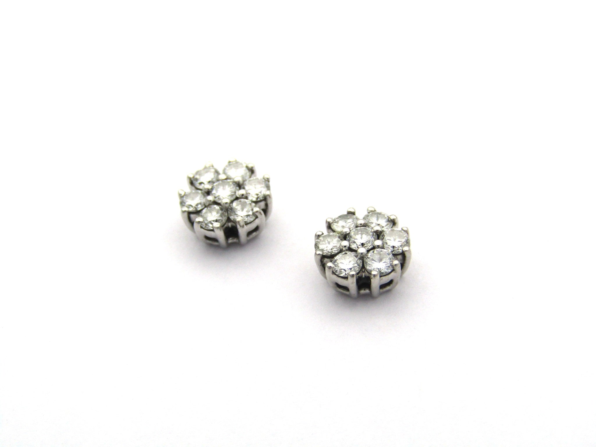 18K gold diamond cluster earrings by Browns.