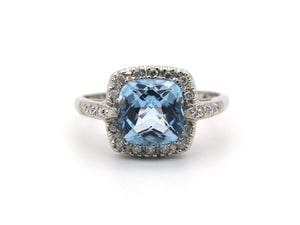 14K gold blue topaz and diamond ring.