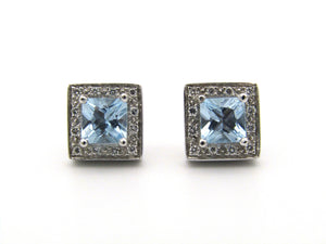 A pair of 18kt gold Blue Topaz and diamond earrings.