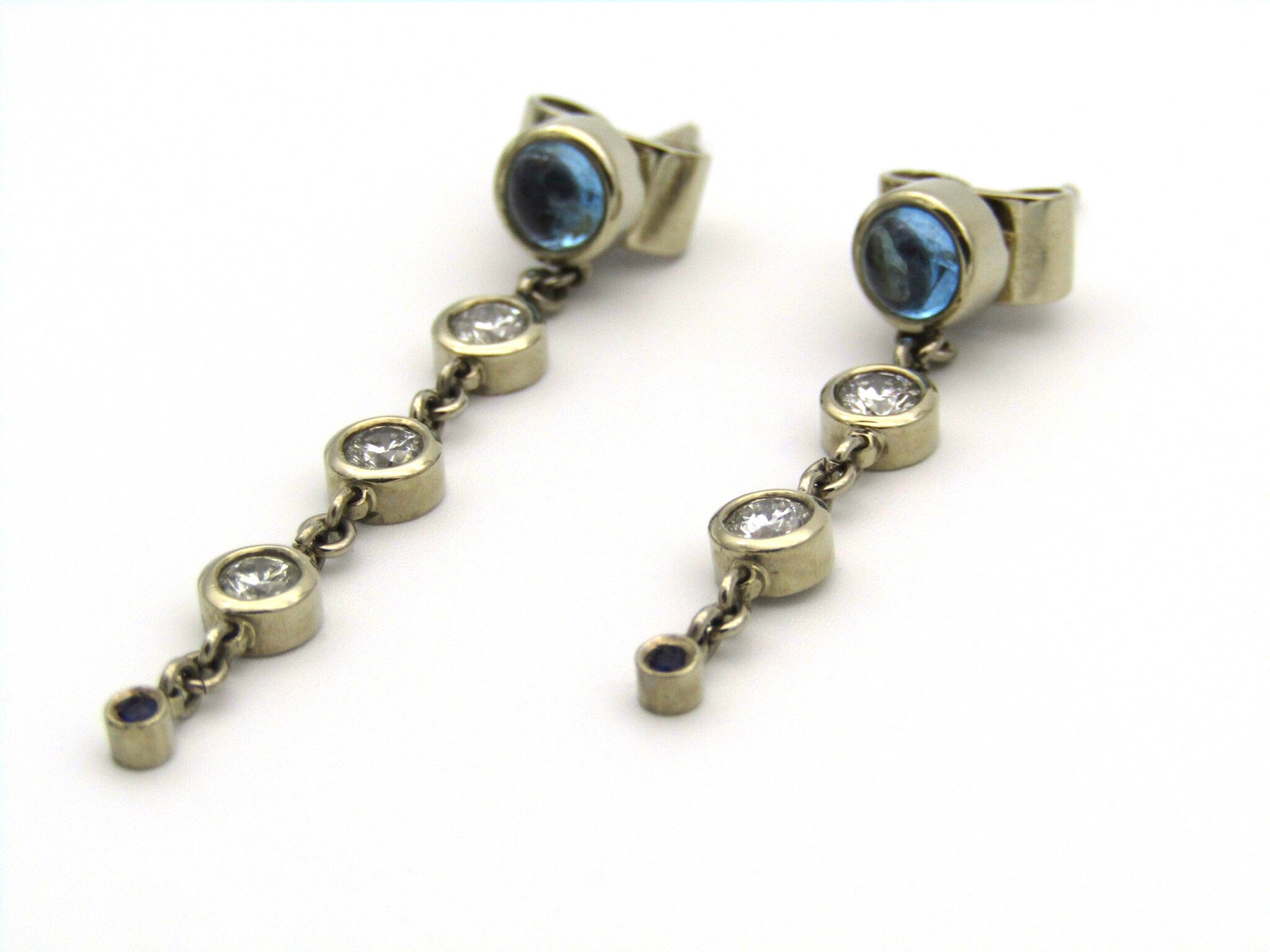 18kt gold diamond and blue topaz earrings by Orpheo.