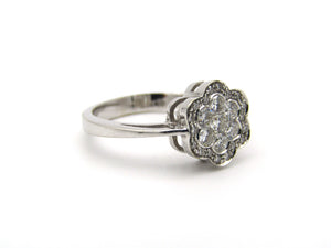 18K gold diamond flower ring.