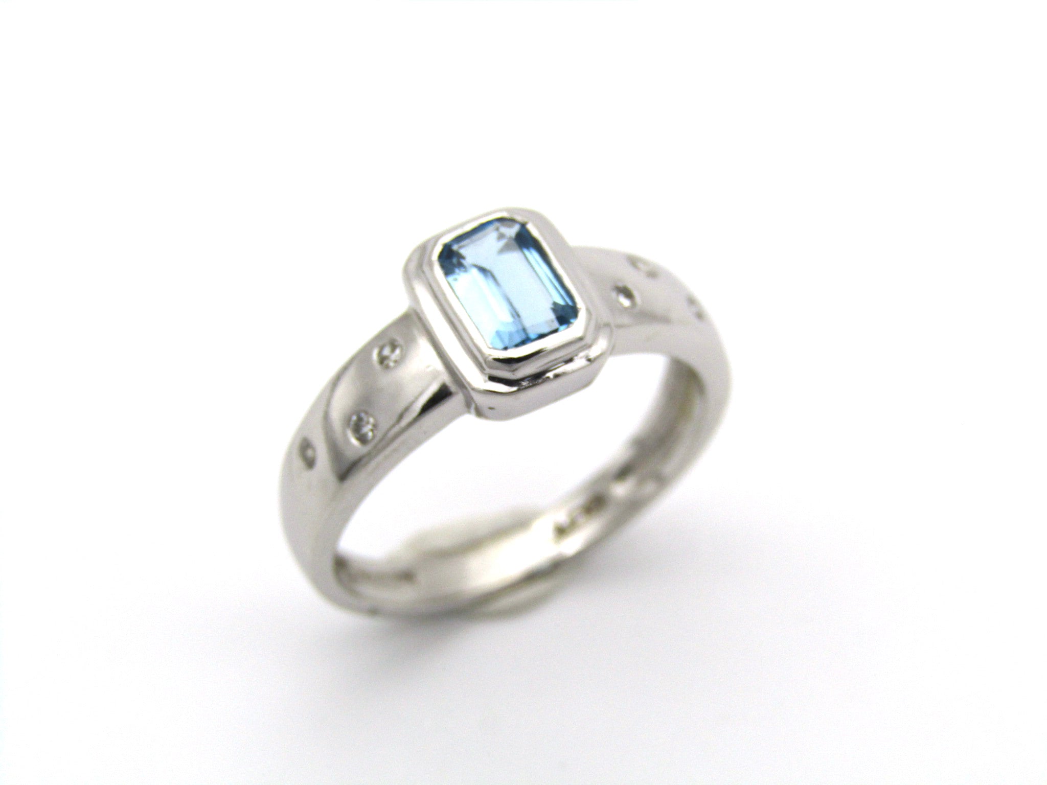 9K gold blue topaz and diamond ring by Browns.