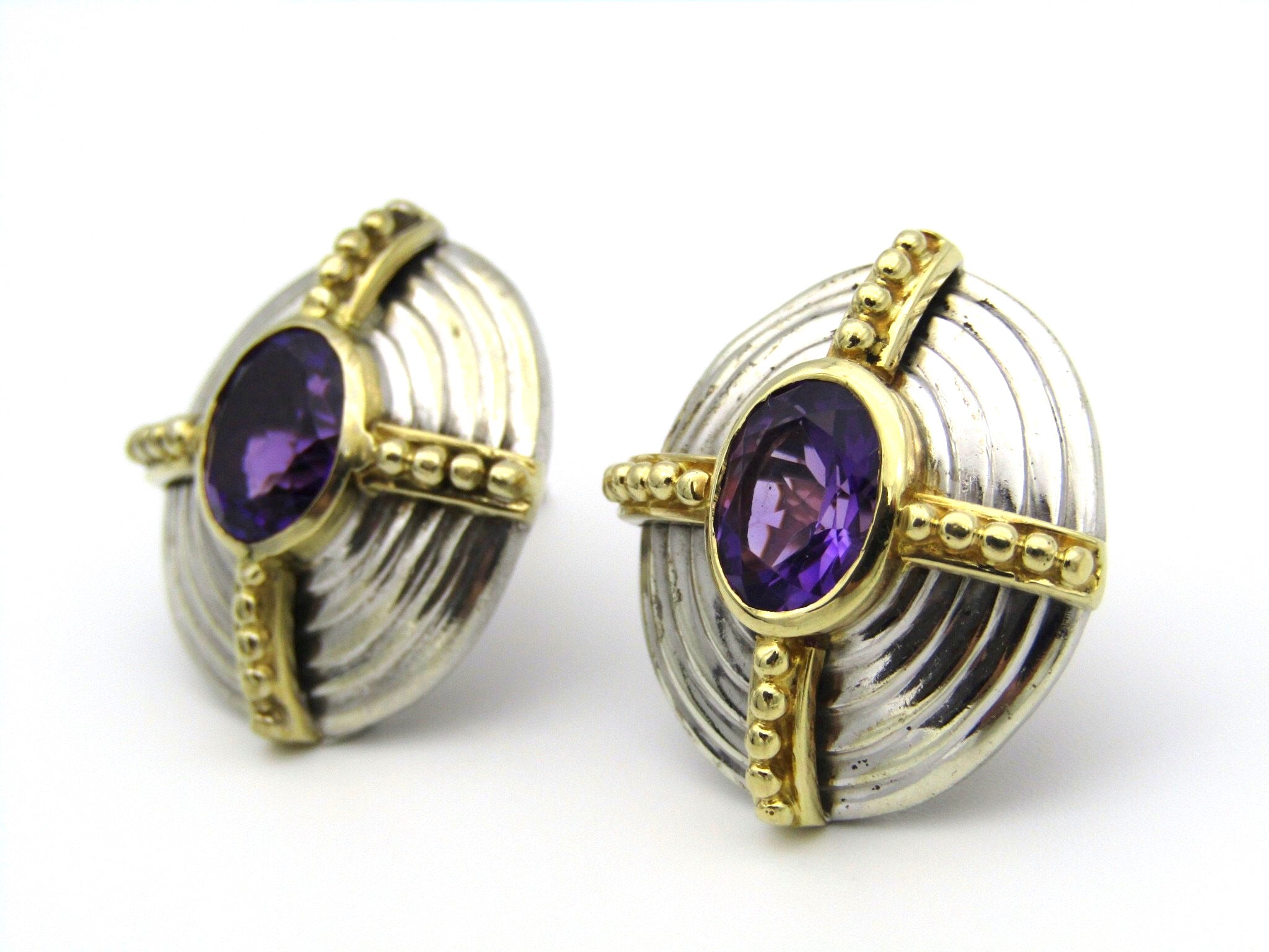 A pair of 18kt and 9kt gold amethyst earrings.
