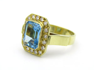 18kt yellow gold blue topaz and diamond ring.