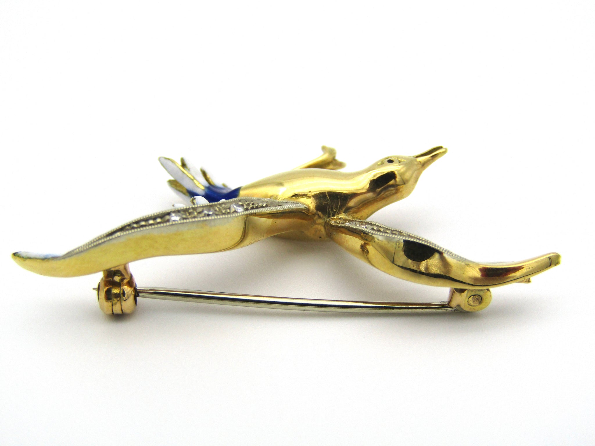 18kt gold diamond and enamel "Bird in flight" brooch.