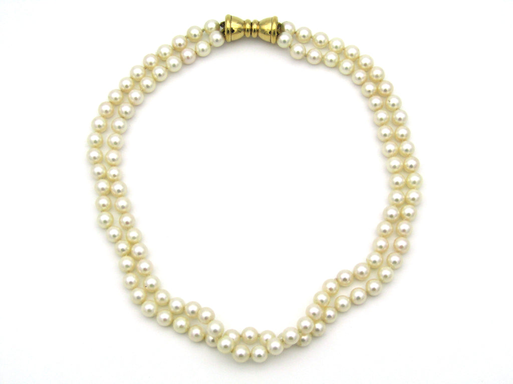 Double strand of pearls with gold plated magnetic clasp.