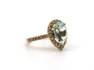 18K gold aquamarine, diamond, and sapphire ring.