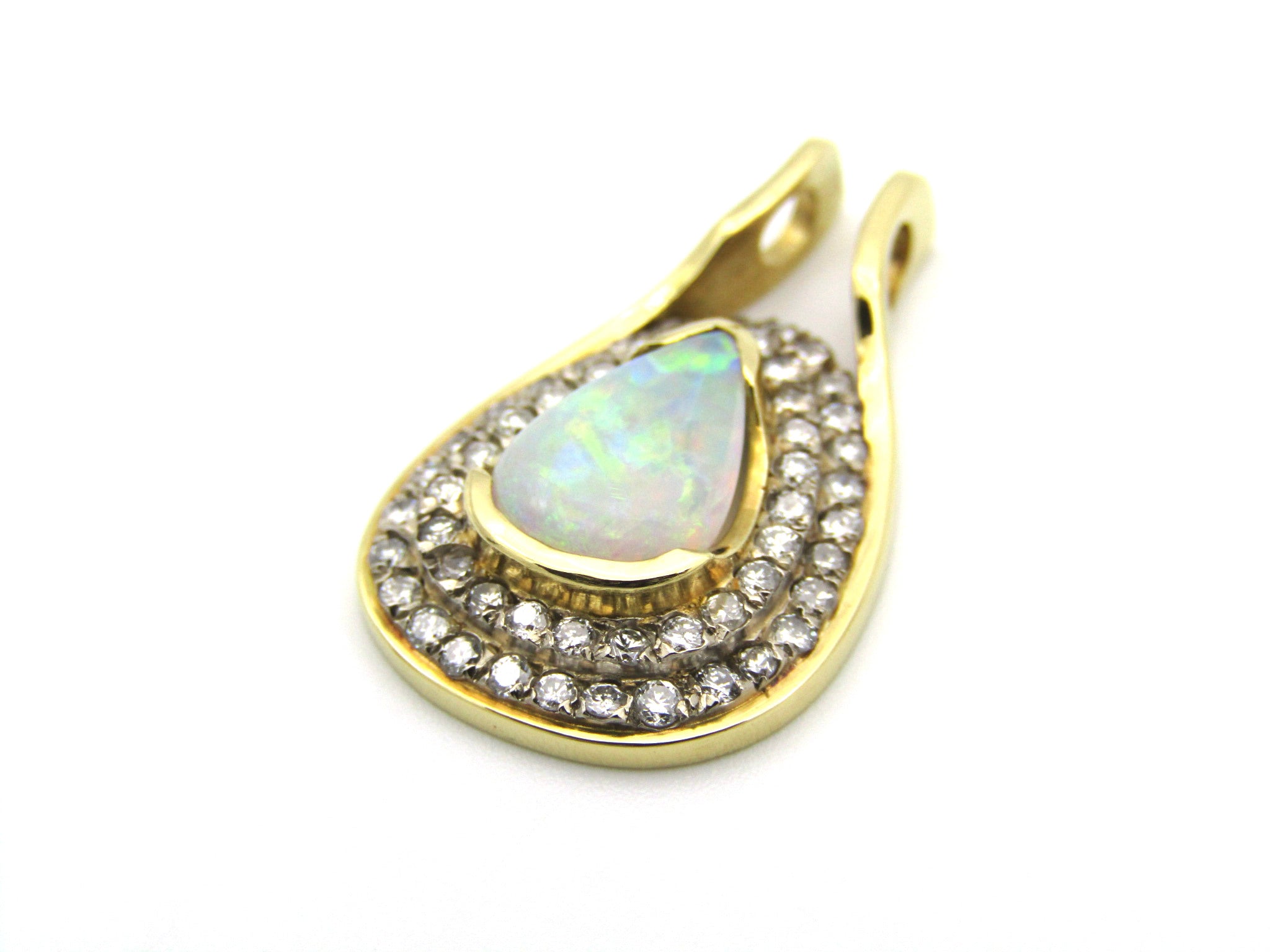 18K gold opal and diamond pendant.