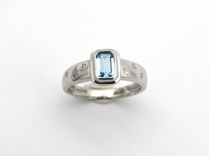 9K gold blue topaz and diamond ring by Browns.