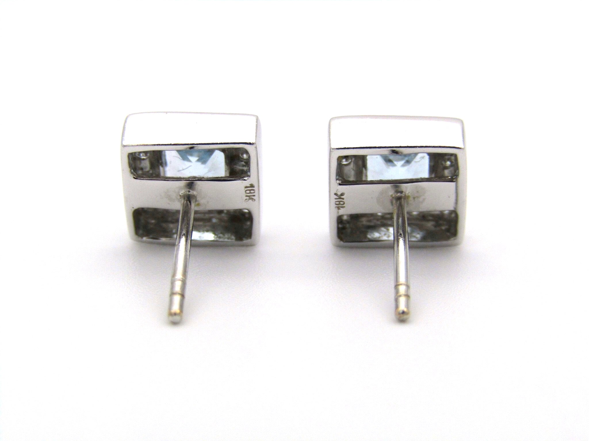 A pair of 18kt gold Blue Topaz and diamond earrings.