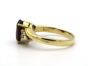 18kt yellow gold garnet and diamond ring.
