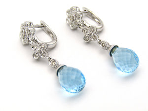 14kt gold blue topaz and diamond earrings.