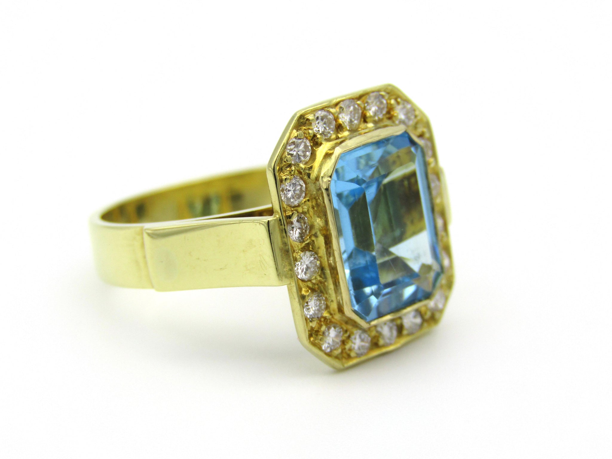 18kt yellow gold blue topaz and diamond ring.