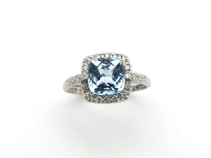 14K gold blue topaz and diamond ring.