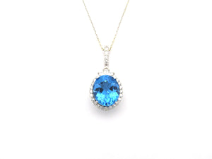 18K gold blue topaz and diamond pendant by Browns.