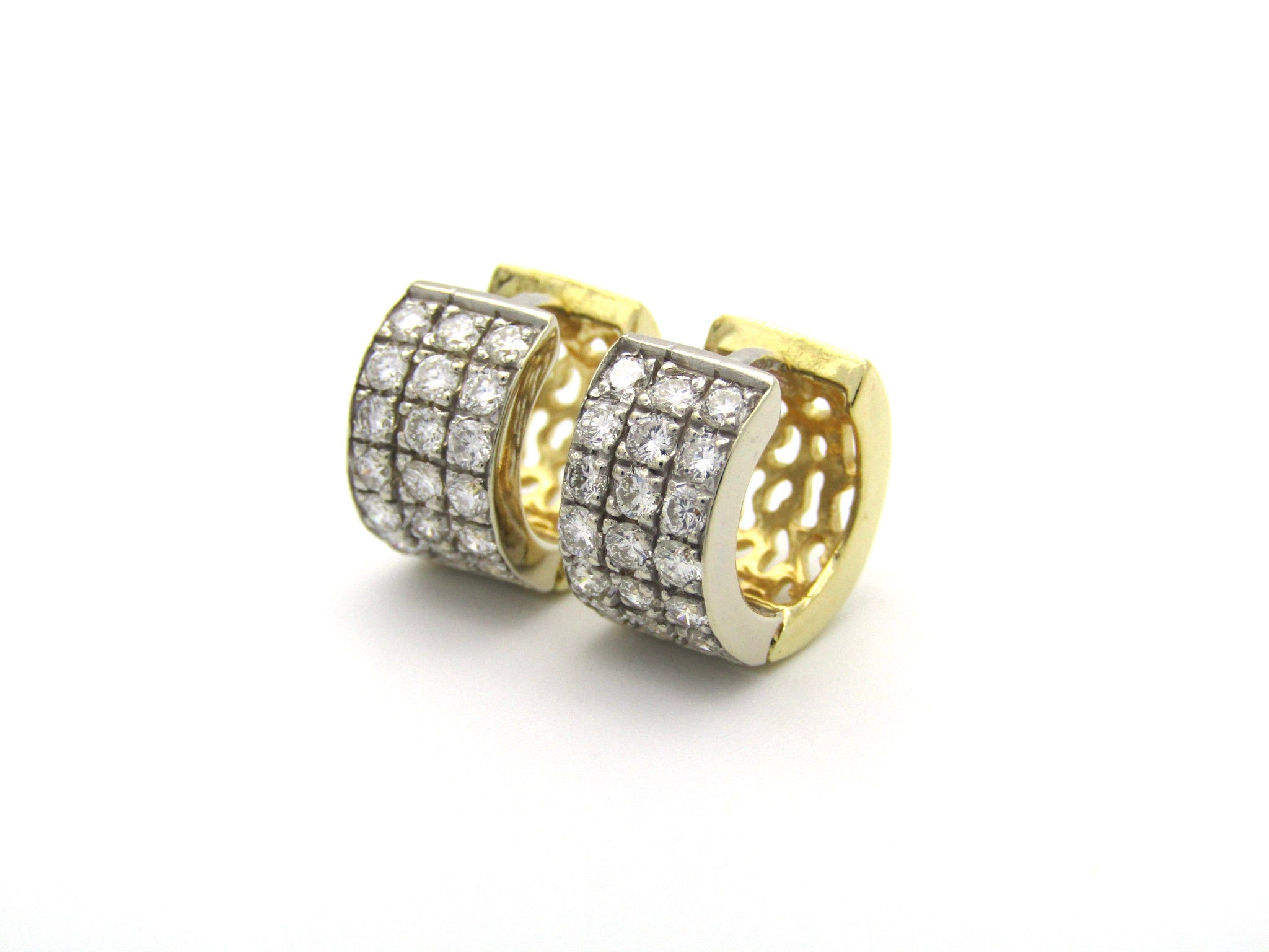 18K gold diamond huggie earrings.