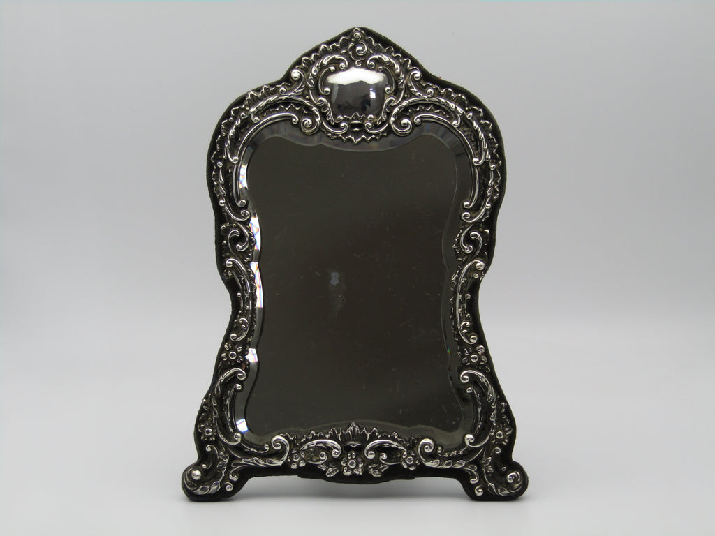 Silver mirror by H. Matthews, made in Birmingham, England, in the year 1902.