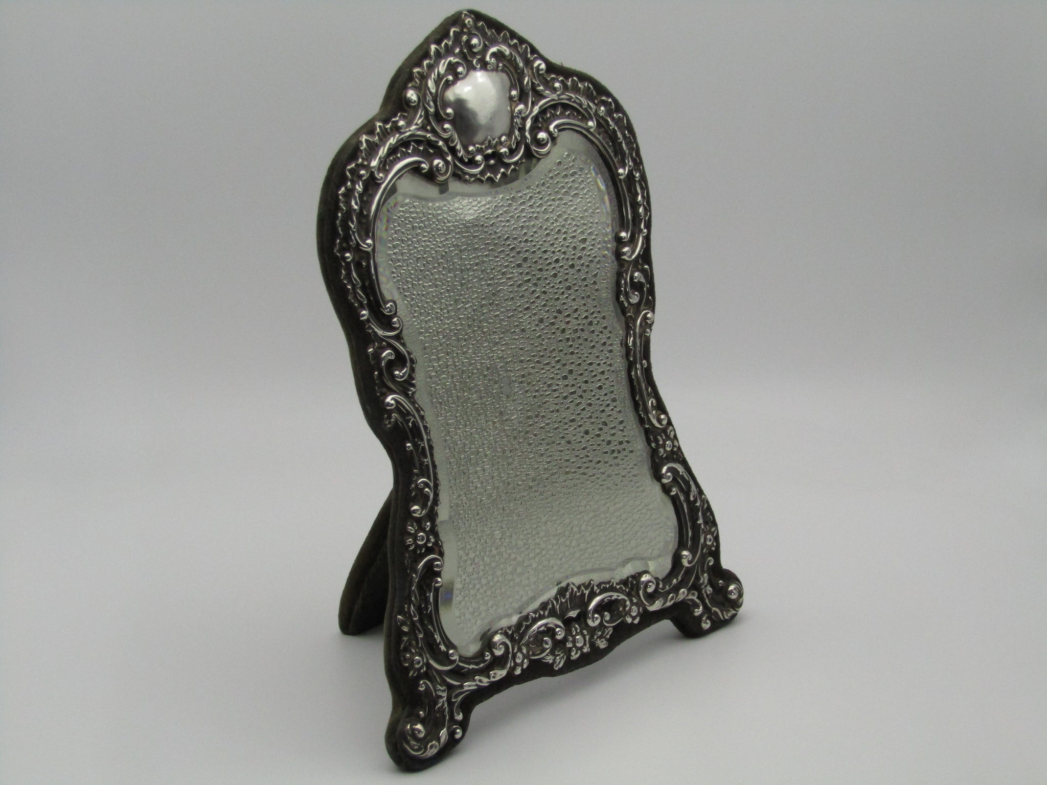 Silver mirror by H. Matthews, made in Birmingham, England, in the year 1902.